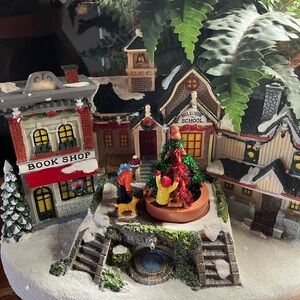 St. Nicholas Square Holiday Village with Green and Red Accents. Animated